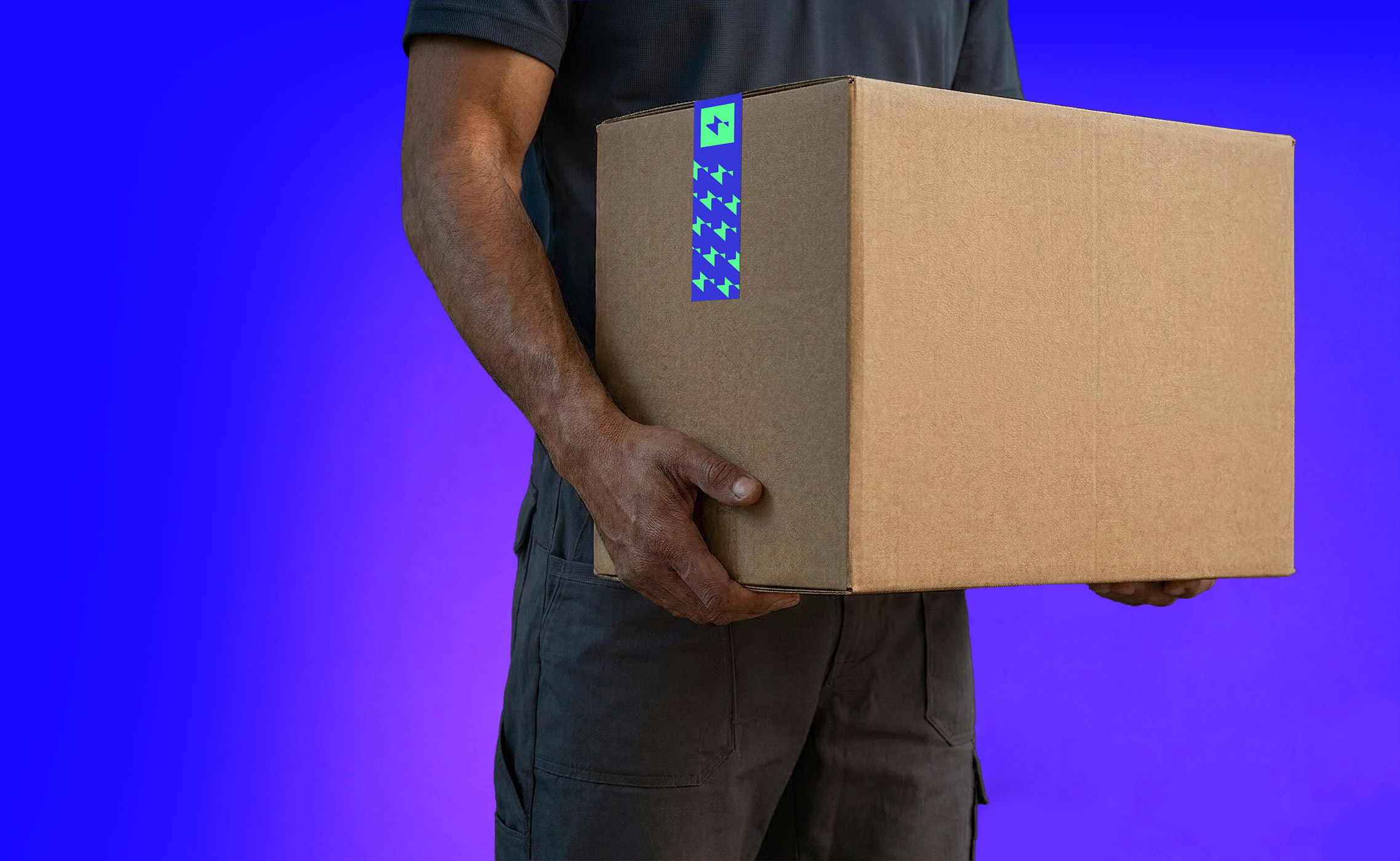 An engineer holding a Zuno branded box